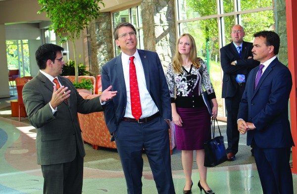 Casey Cooper (left), Cherokee Indian Hospital chief executive officer, shows North Carolina Governor Pat McCrory (center) around the new Cherokee Indian Hospital facility on Friday, Oct. 23. Principal Chief Patrick Lambert (right) and Tribal Council representatives also were on the tour. (ROBERT JUMPER/One Feather photos) 