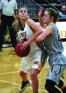 Cherokee’s Tori Teesateskie (#3) goes inside for a shot against Hayesville’s Emma Cox (#22) during a home game on Tuesday, Jan. 26.  Teesateskie, who scored 12 points on the night, was one of four Lady Braves in double figures.  