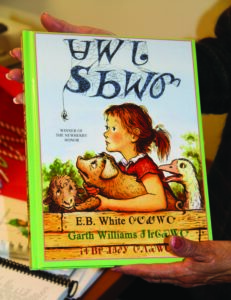 Driver holds a copy of “Charlotte’s Web” which she translated into the Cherokee language. 