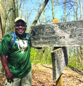 Great Smoky Mountains National Park Superintendent Cassius Cash is shown hiking the Cove Mountain Trail in the Park.  (NPS photo) 