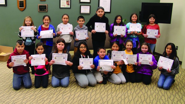 A total of 17 Cherokee Elementary School students received Achievement Certificates on Friday, Feb. 19 in recognition of reaching 750 minutes of Classworks instruction.  They are shown (left-right) back row – Emily Blankenship, Jenna Cruz, Jimya Driver, Breydan Ensley, Kalina Hicks, Danica Hill, Carys Holiday and D.J. Hornbuckle; front row – Kaesyn McCoy, DaLaina Mills, Kelly Pete, Kaniah Reed, Cassius Ross, Shelby Solis, Evonne Stamper, Ann Toineeta and Awee Walkingstick.  (SCOTT MCKIE B.P./One Feather) 