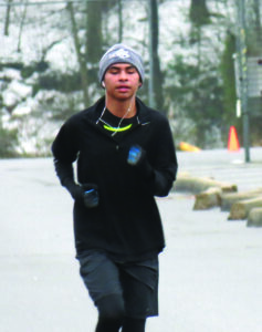 Darius Lambert, a member of the Cherokee High School cross country team and a Junior Olympic runner, is shown winning the 2014 Moccasin Run.  (Photo courtesy of Cherokee Runners) 
