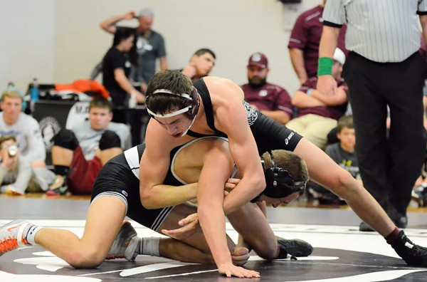 Cherokee’s Anthony Toineeta (top) is shown wrestling Robbinsville’s Brady Lovin in the semifinal match in the 145lb division at the SMC Championships on Saturday, Jan. 30.  Toineeta won the match and went on to win the entire division.  (Photo courtesy of Sean Brooks) 