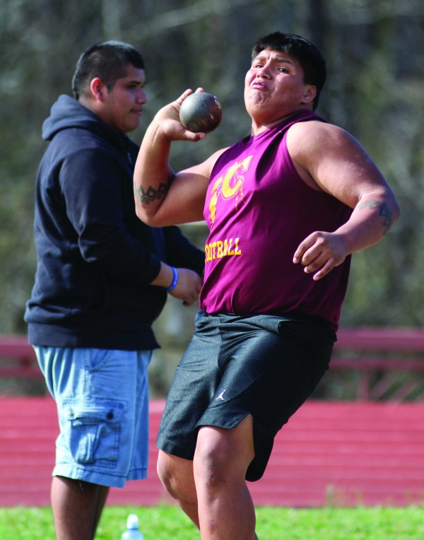 Byron Locust puts his all into a throw. He placed third in both the shot put (38’10”) and the discus (95’11”). 