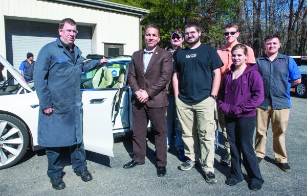 Vice Chief Richard Sneed (second from left) visited Southwestern Community College on Feb. 17 to discuss the college’s Native American MENtoring program. He also gave students in SCC’s automotive sytems technology program the opportunity to check out his Tesla vehicle. At left is David Myers, coordinator of SCC’s automotive program. To the left of Vice Chief Sneed are, from left: Ian Daugherty of Otto, Jonathan Watson of Sylva, Ben Crisp of Cullowhee, Jessica Hovis of Franklin and Dylan Johnston of Sylva. (SCC photo) 