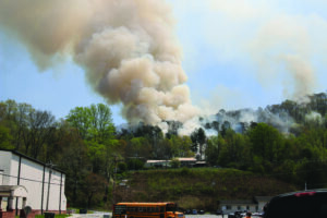 Smoke bellows from behind the Yellowhill Baptist Church on Monday, April 18 due to a wildfire that started the day before. (Photo by Brandon Stephens) 