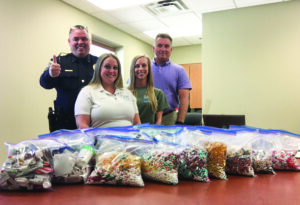 The Cherokee Indian Police Department, in cooperation with Jackson County Safe Kids, collected the following dosage units at its recent Operation Medicine Drop Event: 1,637 controlled substance; 14,026 prescription non-controlled; 8,054 over-the-counter non-prescription; 147 veterinary meds; and 1,817 unknown. Shown (left-right) are Ben Reed, CIPD; Ruby Lawrence and Jenelle Midgett, both with Jackson County Safe Kids; and Glen Weeks, CIPD Detention jail administrator. (CIPD photo) 