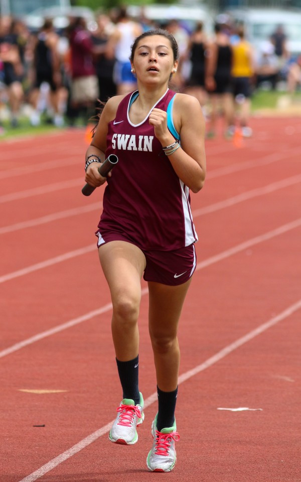 Lynsey Hicks, an EBCI tribal member at Swain County High School, runs a leg in the 4x800M relay.  The Lady Maroon Devils team, which included Hicks, Shelby Hyatt, Emma Pindur and Madison Travitz, went on to win the race with a time of 10:03.92.  Hicks also took second place in the 800M (2:29.66) and first place in the 4x400M Relay (4:11.63).  