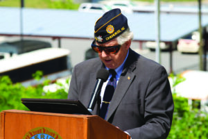 Lew Harding, Post 143 Commander, gives opening remarks during Monday’s event. 