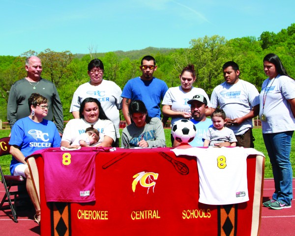 With her family looking on, Sidnie Yanez (seated center), signs a letter of intent on Friday, April 29 to play Soccer at Brevard College. (AMBLE SMOKER/One Feather) 