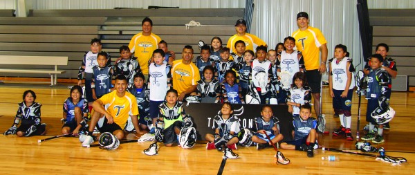 Thompson Brothers Lacrosse instructors pose with some of the younger attendees at a Youth Lacrosse Camp at the Birdtown Gym on Wednesday, July 6. (SCOTT MCKIE B.P./One Feather photos) 