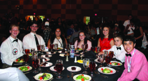 Shown (left-right) at a dinner during the Conference are Jackson Warshaw, Jacob Long, Nola Pina, Evie Cotterman, Hope Long, Ayden Evans, and Eason Esquivel.