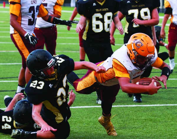 Bobby Crowe, JV Braves quarterback, dives into the end zone at the end of a 19-yard touchdown run in the first half of Thursday’s game at Hayesville. He ended the game with two rushing touchdowns and two passing touchdowns. (SCOTT MCKIE B.P./One Feather photos) 