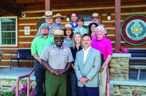  Chief Lambert (front, right) met with Cassius Cash (front, left), Great Smoky Mountains National Park superintendent, and other National Park Service officials on Monday, Aug. 1 to discuss plant gathering rules in the Park. (EBCI Communications photos) 