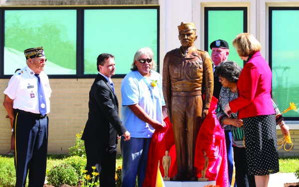 AMERICAN HERO: A life-size statue of PFC Charles George, an EBCI tribal member and Medal of Honor recipient, was unveiled at the Charles George VA Medical Center in Asheville on Saturday, Sept. 24. (SCOTT MCKIE B.P./One Feather) 