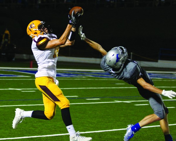  Anthony Toineeta, Braves senior wide receiver, catches a 22-yard touchdown pass over the outstretched arms of Smoky Mountain junior defensive back Tyler Waliezer.  