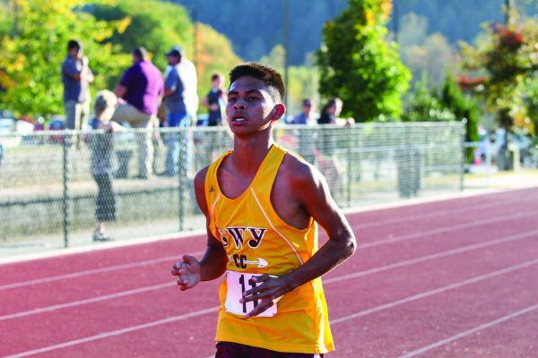 Cherokee’s Darius Lambert runs down the back stretch en route to winning the Smoky Mountain Conference title on Wednesday, Oct. 19 with a time of 17:02.65. (SCOTT MCKIE B.P./One Feather) 