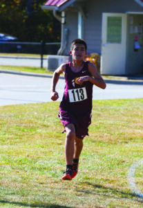 Rocky Peebles, Cherokee Middle, is all alone in front as he heads towards the finish line of Wednesday’s middle school conference championship. He won the title with a time of 11:20.61 over the two-mile course. (SCOTT MCKIE B.P./One Feather) 