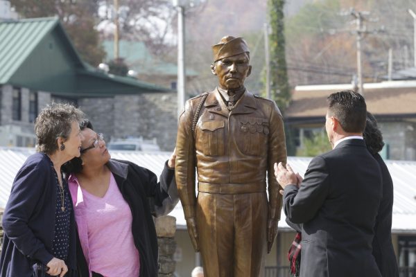AMERICAN HERO: A bronze statue of PFC Charles George, Medal of Honor recipient, is unveiled during a ceremony at the Park on Veteran’s Day, Friday, Nov. 11. (SCOTT MCKIE B.P./One Feather photos) 
