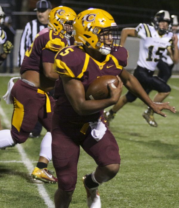 Isaiah Evans, Braves sophomore running back, scoots to the outside on a touchdown run in the first half. He finished with 10 carries, 104 yards, and two touchdowns.