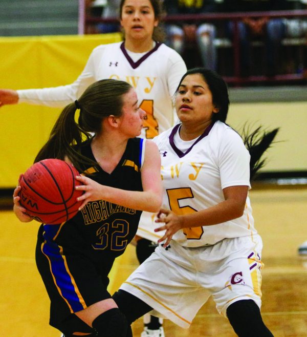 TIGHT COVERAGE: Cherokee’s Jamie Lossiah (#5) closely guards Highlands’ Emily Crowe (#32) in a game at Charles George Memorial Arena on Tuesday, Dec. 6.  On the night, Lossiah had 2 pts, 5 assists, and 1 steal as the Lady Braves opened their season with a huge 83-23 victory over the Lady Highlanders.  (SCOTT MCKIE B.P./One Feather) 